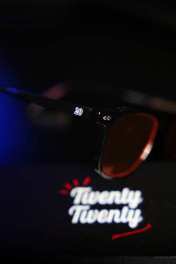 Black Frame — Orange Lens